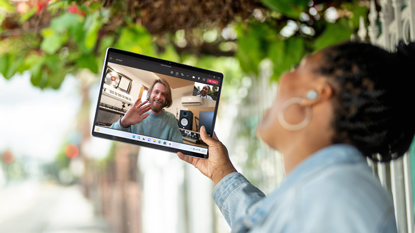 A student using Microsoft Teams to connect with a friend over a video call.