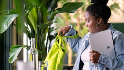 A student packing their Surface devices for a return.