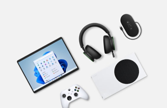 A Surface Pro 8 in Platinum,  Xbox Wireless Headset, Microsoft Modern U S B-C Speaker and Xbox Series S.