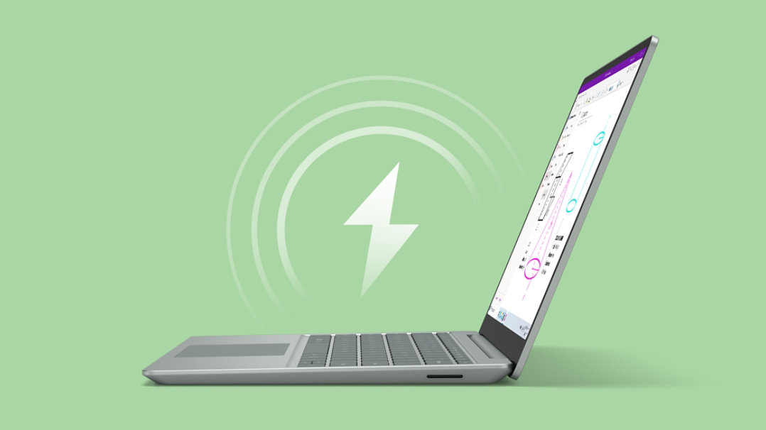 Side view of sage Surface Laptop Go 3 with OneNote on screen and a charging icon floating above the device.