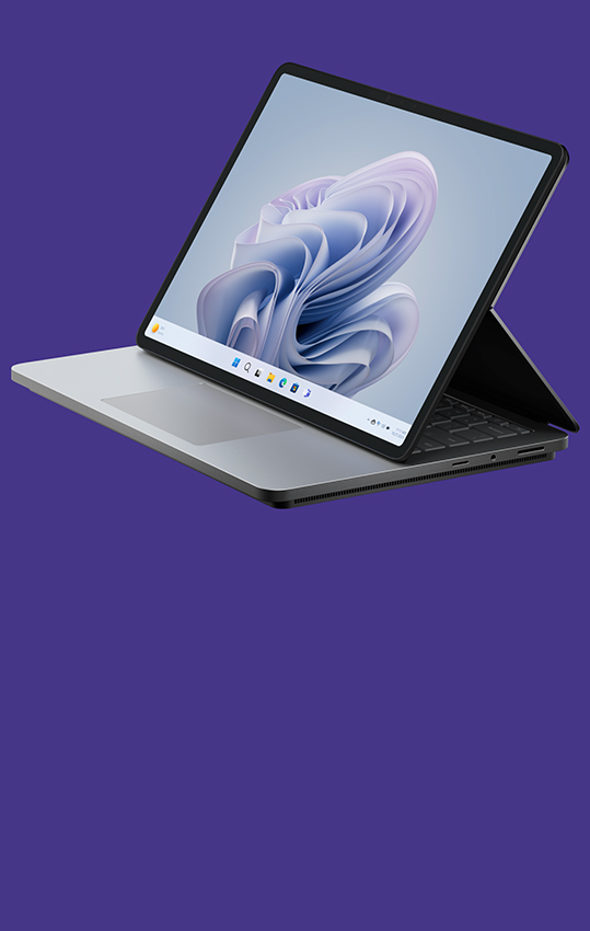 Side angle of Surface Laptop Studio 2 displaying a Windows bloom screen.