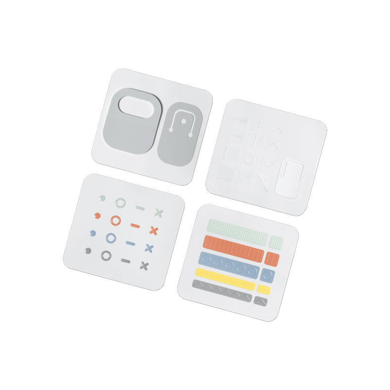 Pieces of the Microsoft Adaptive Kit are shown including cord markers, key markers and lid opener.