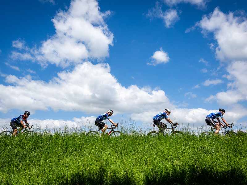 Cycling 4 Climate participants cycling over a dyke in the Netherlands.