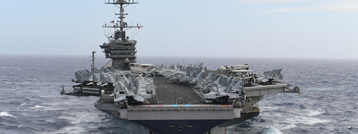 US Aircraft Carrier moving through ocean